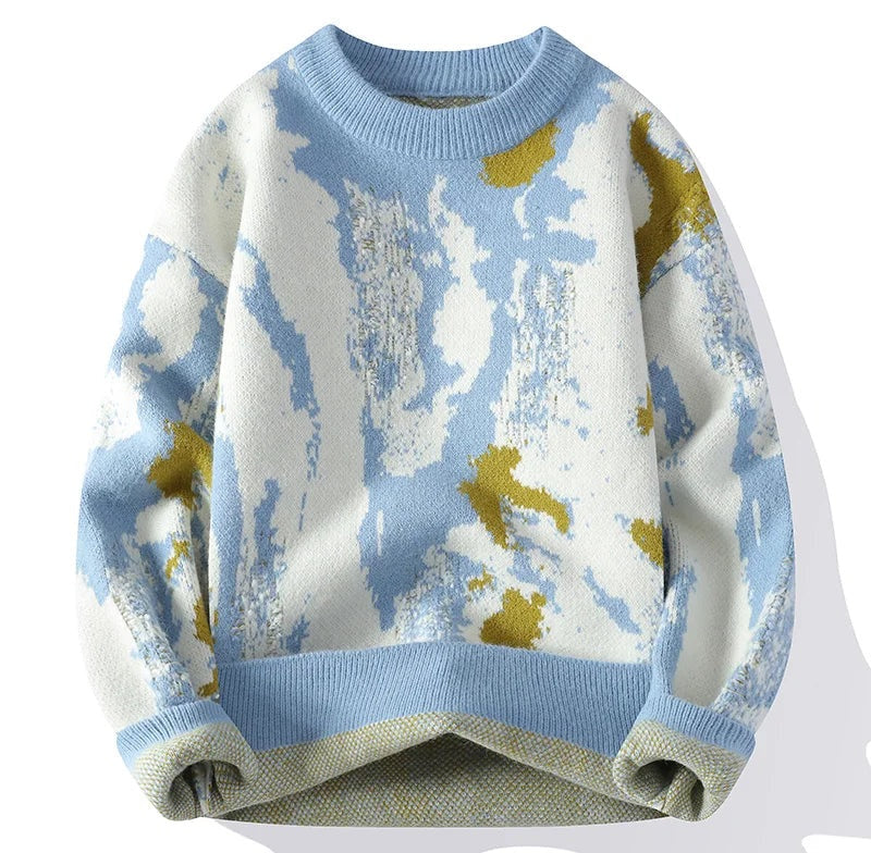 Blue and white knit sweater with an abstract pattern and mustard yellow accents, crew neck and ribbed cuffs and hem, mid weight fabric.
