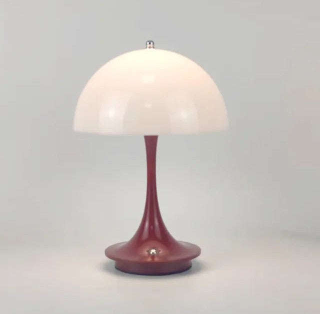 Aurumline LED table lamp with a white dome shade and a slender burgundy stem on a round base.