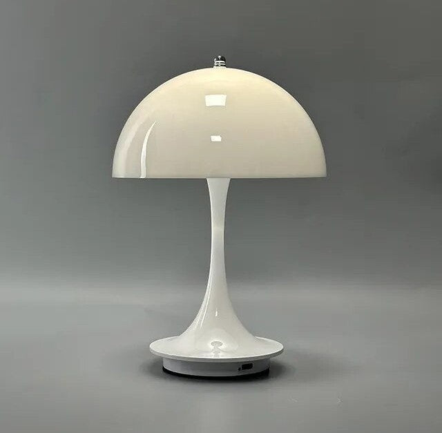 White glossy LED table lamp with a dome shaped shade, slender curved stem, and round base on a flat gray surface