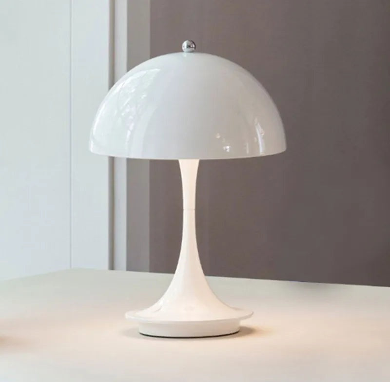 White modern LED table lamp with a glossy dome shade and a slim curved stem on a round base