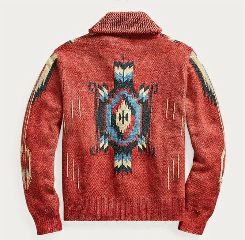 red jacquard knit cardigan shown from the back with a large geometric central motif in blue white and black long sleeves and ribbed cuffs and hem