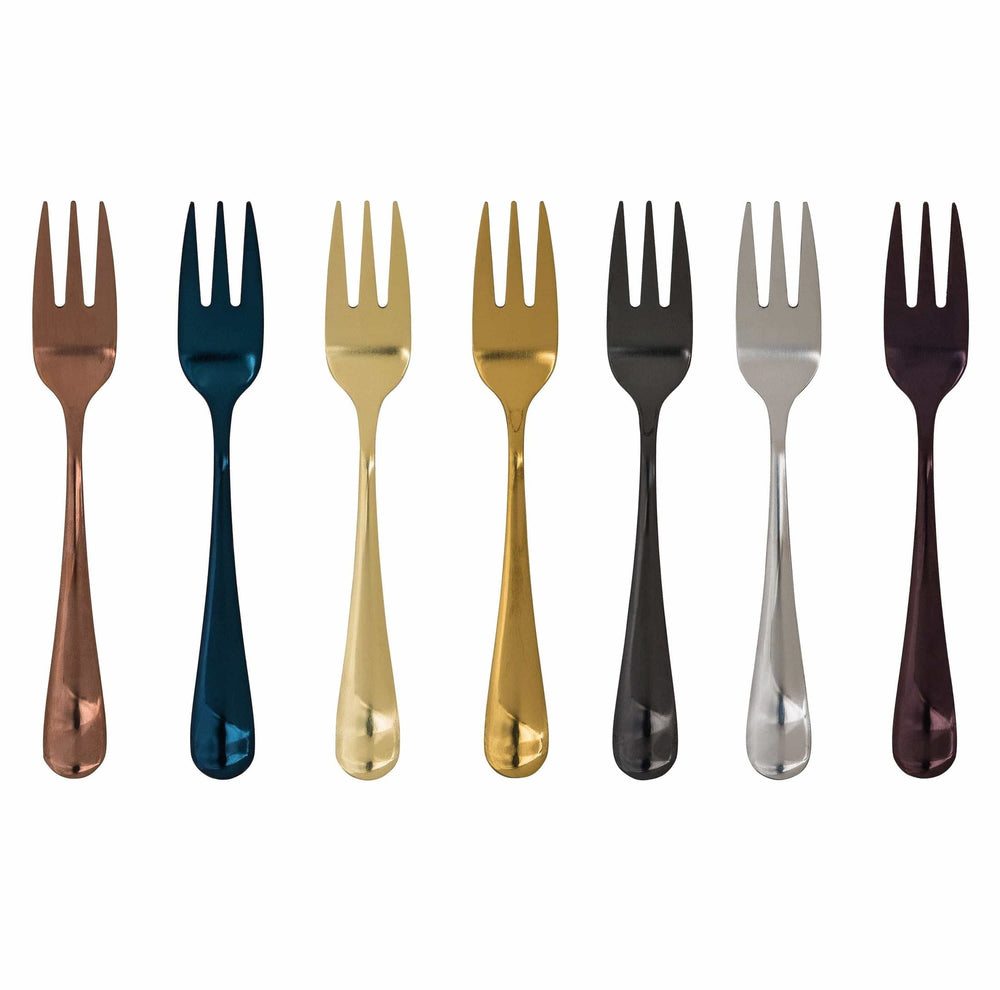 Eight plated stainless steel salad forks with intricate patterned handles in copper, dark blue, light gold, gold, gunmetal, silver, light gray, and burgundy finishes lined up