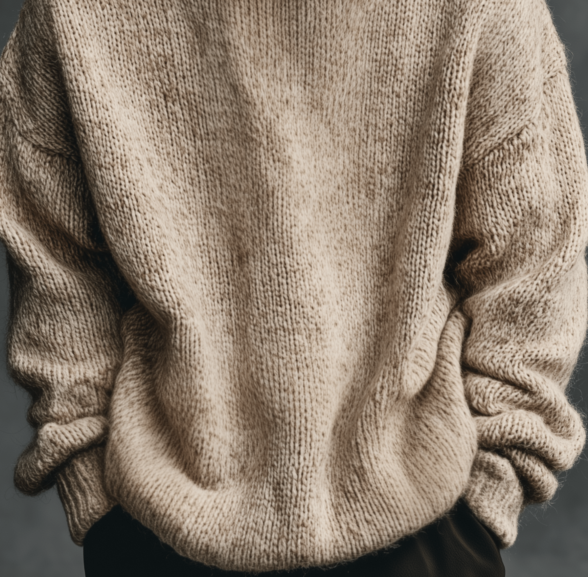 Beige chunky knit sweater close up with a soft mid weight knit and ribbed cuffs and hem