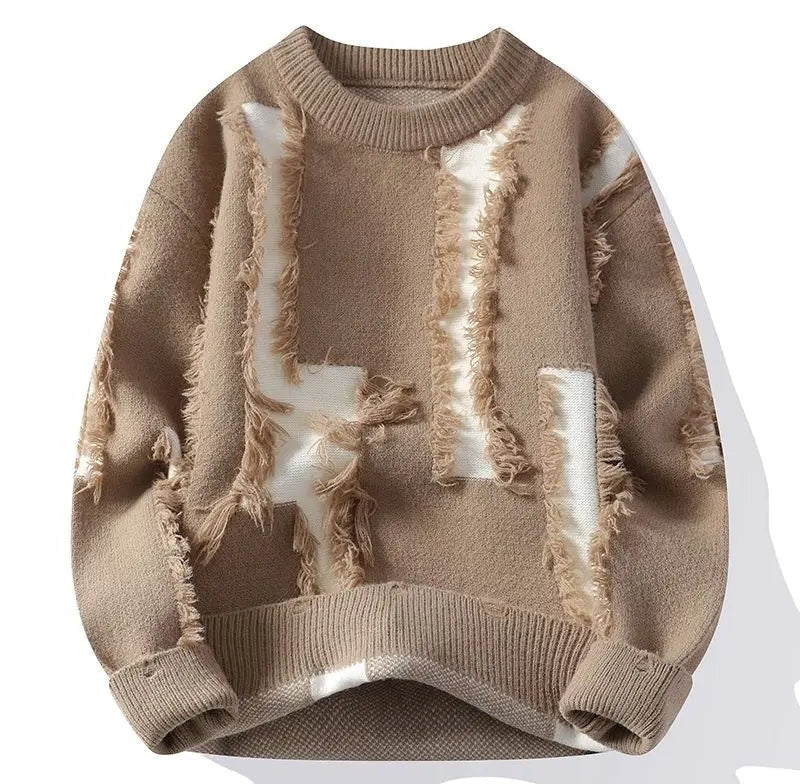 Beige distressed knit crewneck sweater with layered textured panels and frayed patches