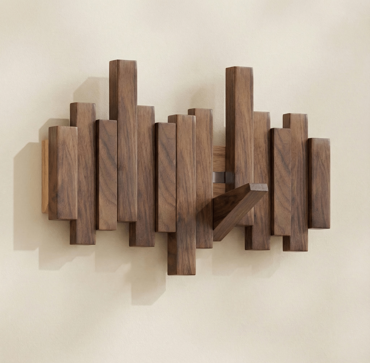 Sonata wall coat rack in natural solid wood featuring a staggered arrangement of vertical rectangular blocks on the wall with a diagonal support piece