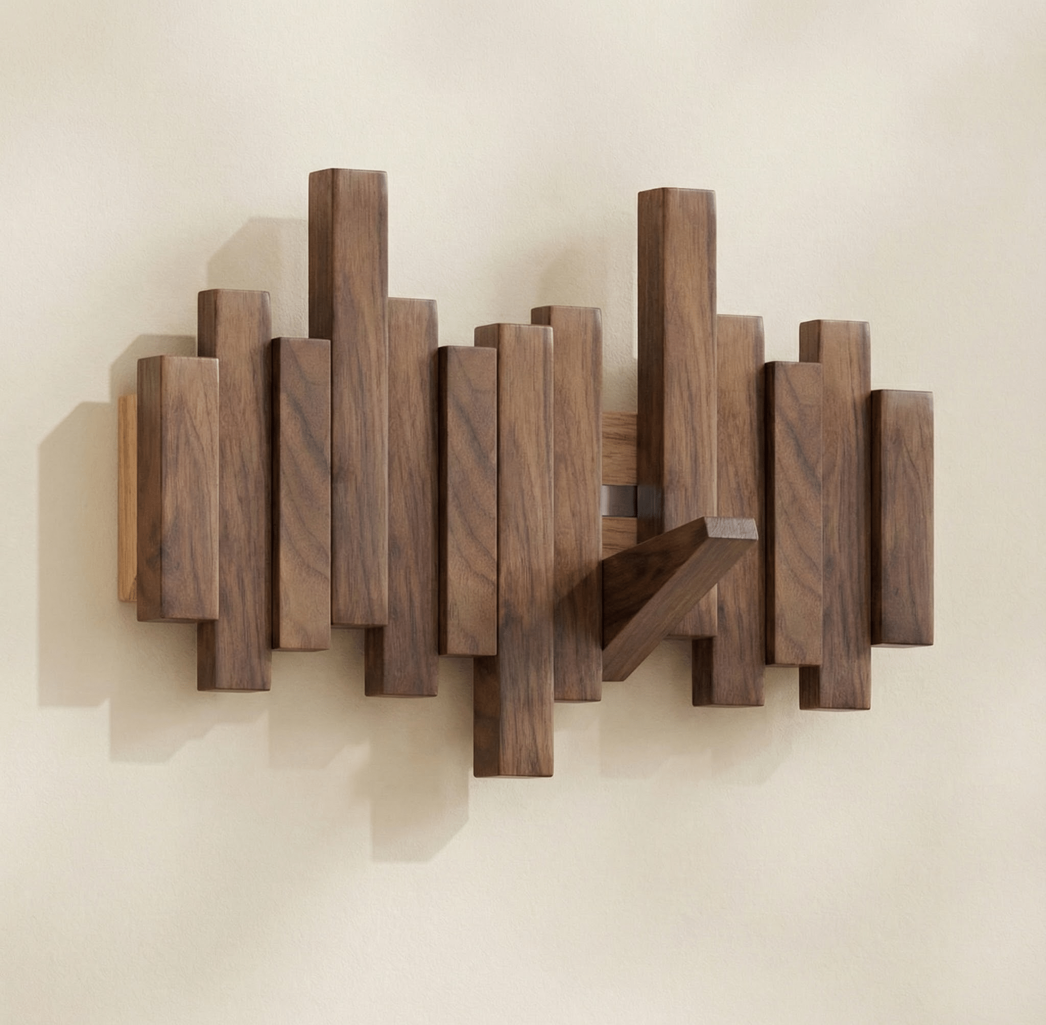 Sonata wall coat rack in natural solid wood featuring a staggered arrangement of vertical rectangular blocks on the wall with a diagonal support piece